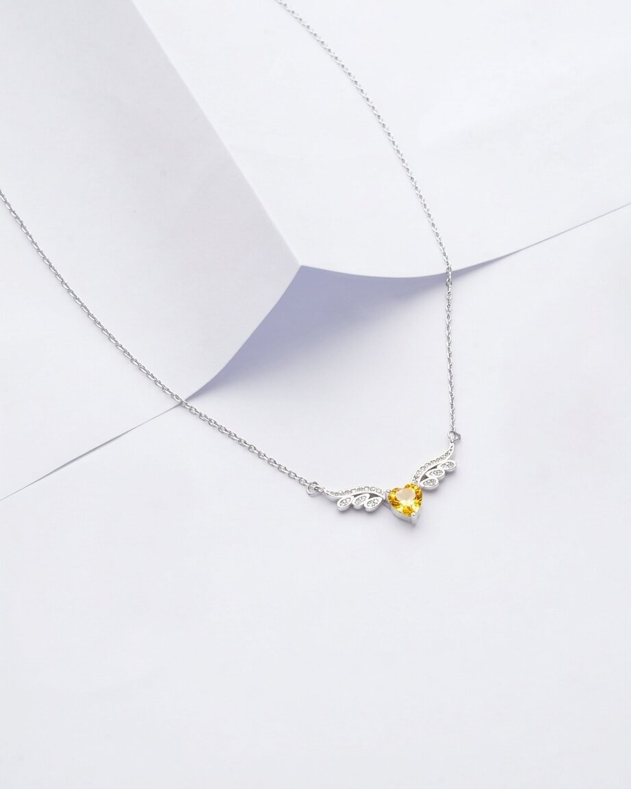 Viorette winged-heart necklace in 925 sterling silver with a yellow citrine-colored stone