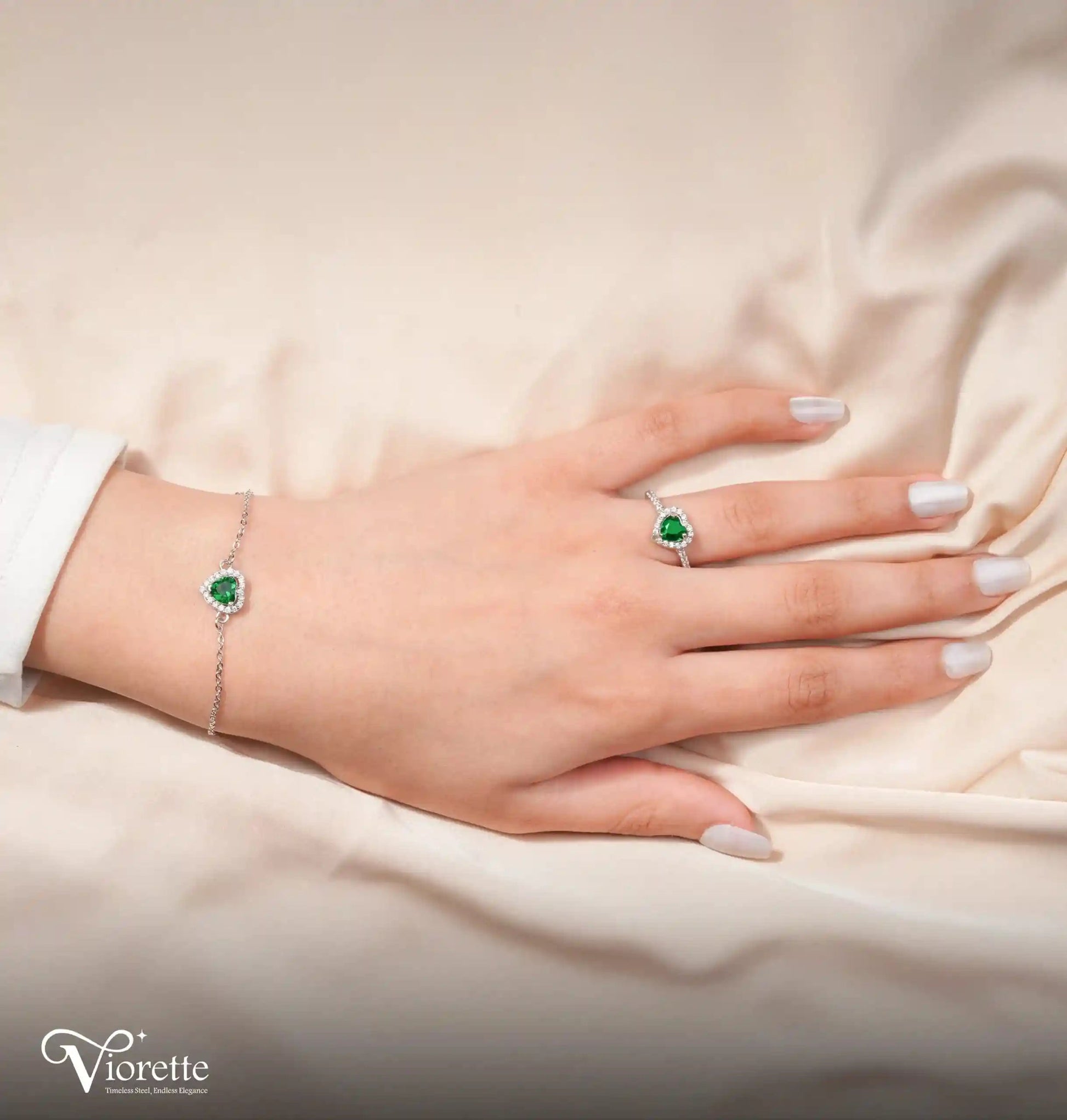 Viorette matching 925 sterling silver bracelet and ring set featuring green crystal hearts