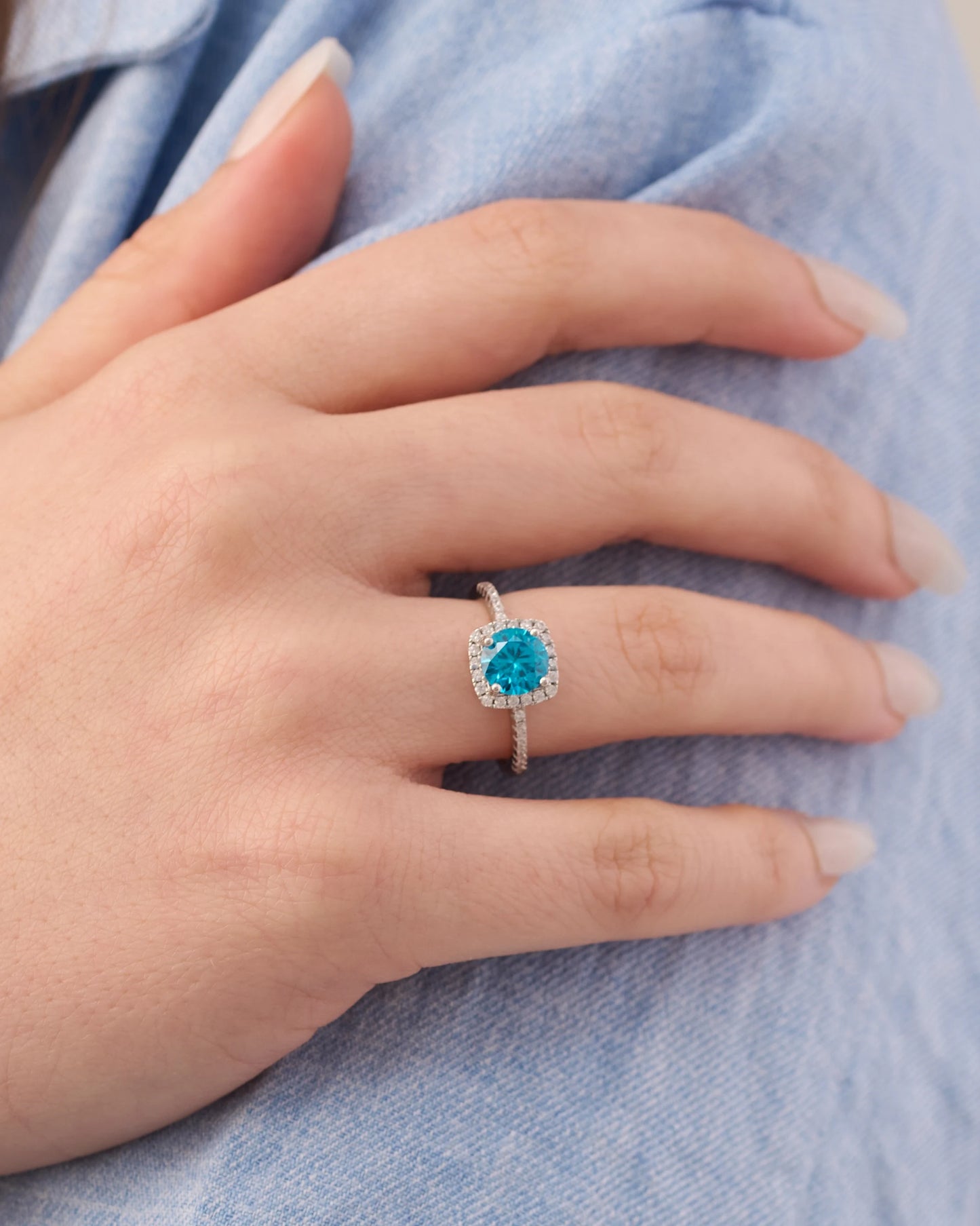 Viorette halo ring in 925 sterling silver with a sky-blue halo-set stone