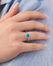 Viorette halo ring in 925 sterling silver with a sky-blue halo-set stone