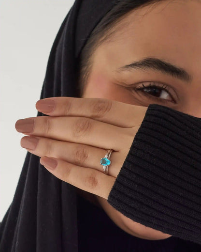 Viorette halo ring in 925 sterling silver with an ocean-blue halo-set stone