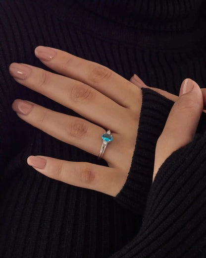 Viorette halo ring in 925 sterling silver with an ocean-blue halo-set stone